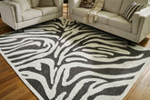 Prime Furniture - Ashley Furniture - Thomwith Rug - 8' x 10'2" Washable Rug / Black/Ivory - R406291
